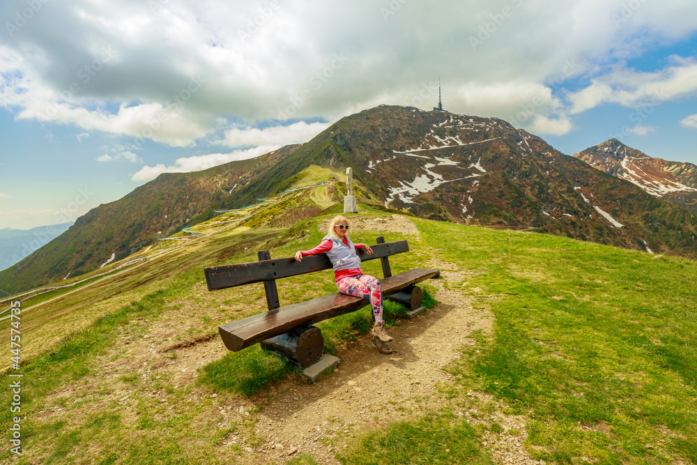 Φωτογραφία Sporty woman in a trekking dress on top of Tamaro mount in Switzerland