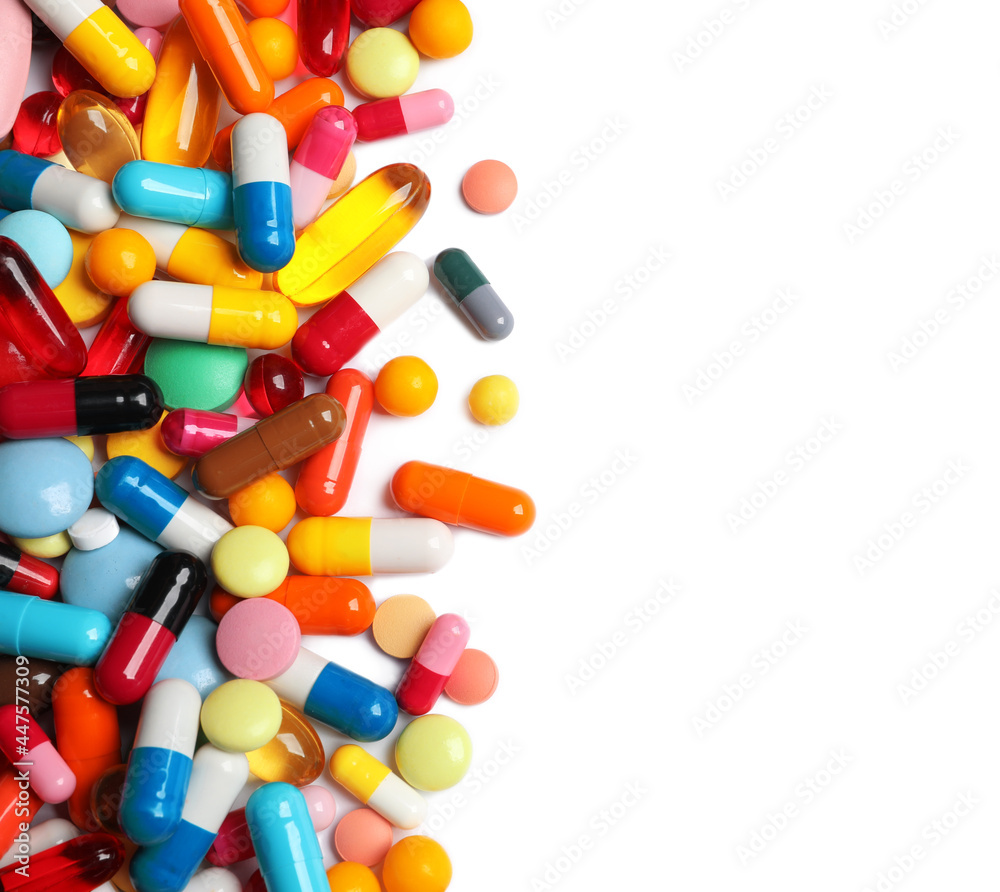 Lots of different colorful pills isolated on white, top view Lots of different colorful pills isolated on white, top view