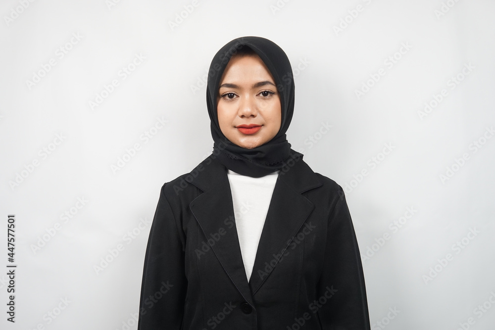 Beautiful asian young muslim business woman isolated on gray background