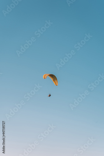  Paragliding at Fethiye Oludeniz. Paragliding is a free flying sport where the pilot launches themselves by foot.Amazing aerial view of beautiful sunset Blue Lagoon in Oludeniz, Turkey.