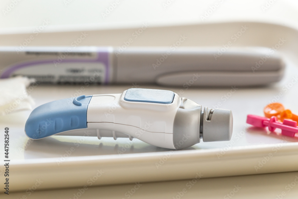 Blood sugar measuring: Close-up of equipment and a lancet to get blood for blood glucose analysis Blood sugar measuring: Close-up of equipment and a lancet to get blood for blood glucose analysis
