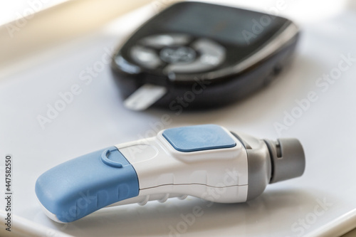 Blood sugar measuring: Close-up of equipment and a lancet to get blood for blood glucose analysis