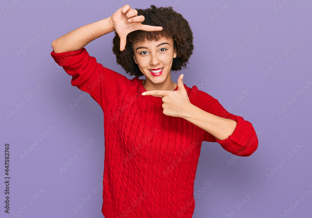 Young hispanic girl wearing casual clothes smiling making frame with hands and fingers with happy face. creativity and photography concept. Young hispanic girl wearing casual clothes smiling making frame with hands and fingers with happy face. creativity and photography concept.