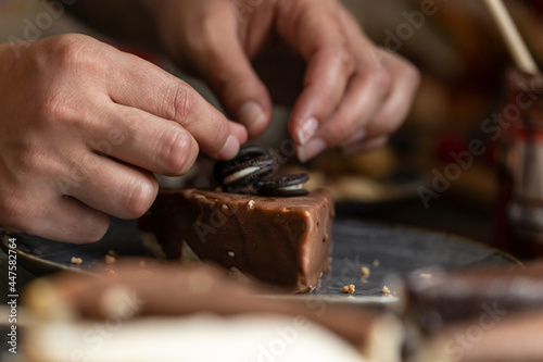 A person preparing cheesecake-sticks