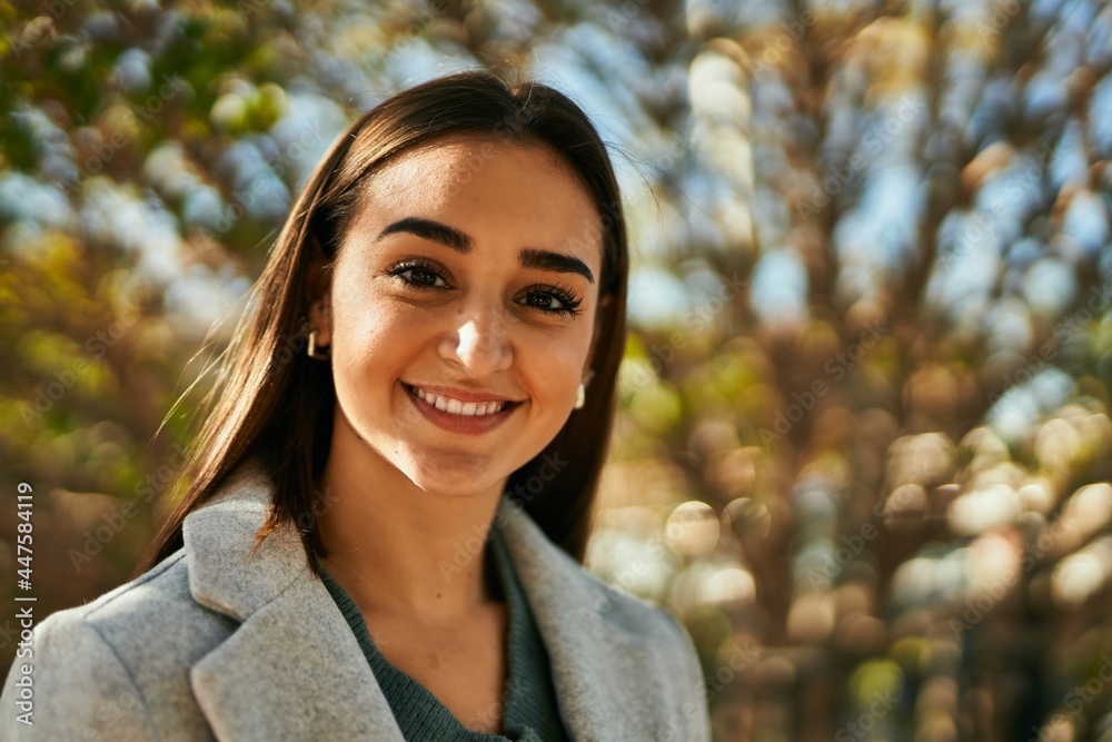 Young hispanic girl smiling happy standing at the park. Young hispanic girl smiling happy standing at the park.