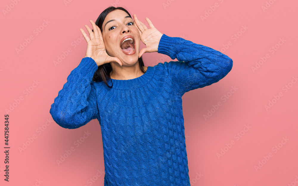 Young hispanic woman wearing casual clothes smiling cheerful playing peek a boo with hands showing face. surprised and exited Young hispanic woman wearing casual clothes smiling cheerful playing peek a boo with hands showing face. surprised and exited