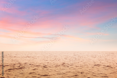 Panorama of calm sea against beautiful pastel skie in the evening at Cha Am, Phetchaburi, Thailand.