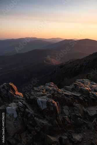 Early spring sunrise light illuminating the boulders and mountains of Stony Man Mountain and Shenandoah National Park in Virginia.