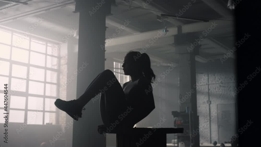 Woman pumping abdominal muscles in sport club. Sporty girl doing abs exercises Woman pumping abdominal muscles in sport club. Sporty girl doing abs exercises