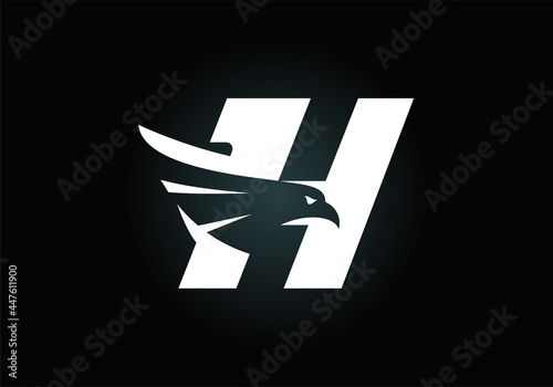 Initial H monogram letter alphabet with Eagle head negative space symbol. Creative Eagle head vector illustration. Modern logo design for business, and company identity.
