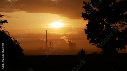 Kominy elektrowni. Wschód słońca. Timelapse. photo