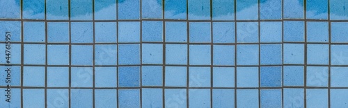 Panorama of Blue Glazed Swimming Pool Floor Tiles texture and background seamless