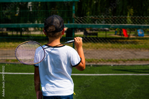 boy with a badminton racket