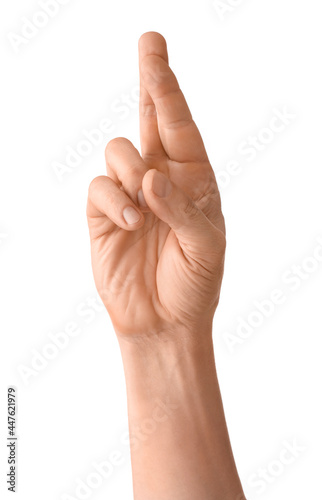 Man with crossed fingers on white background
