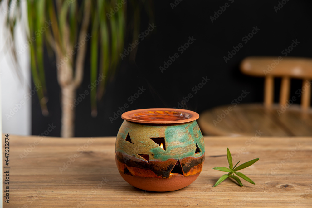 ceramic incense box on the wooden table