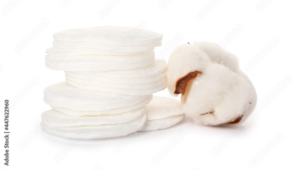 Fototapeta premium Cotton pads and flower on white background