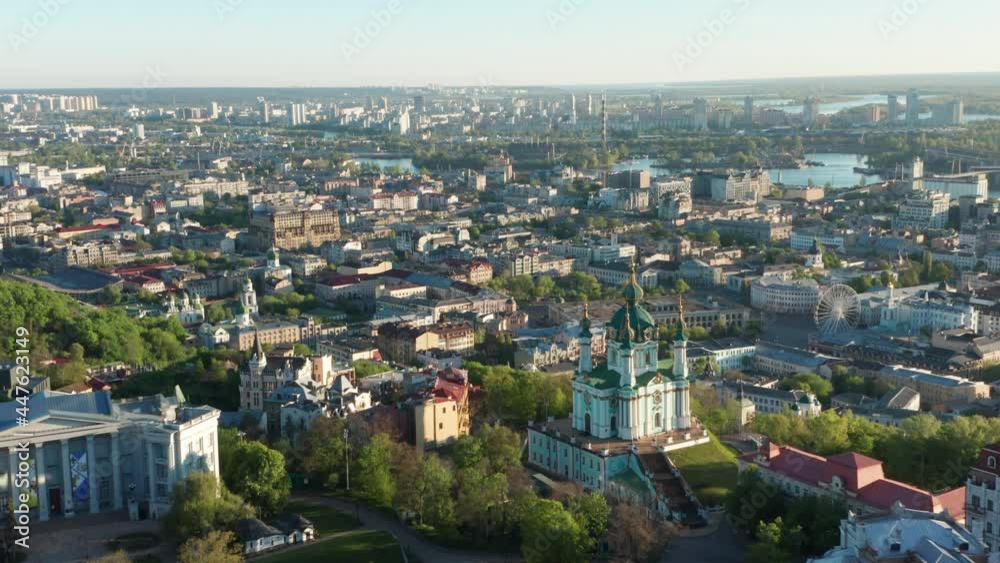Aerial view of church and cyti. City At Sunset. Aerial view of small old european town. Aerial panoramic view of historic brick buildings. Aerial view of church and cyti. City At Sunset. Aerial view of small old european town. Aerial panoramic view of historic brick buildings.