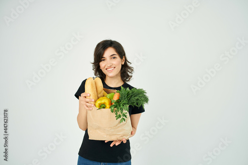 woman with package of groceries delivery service supermarket