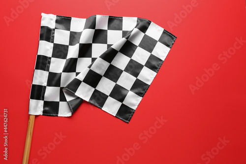 Racing flag on color background
