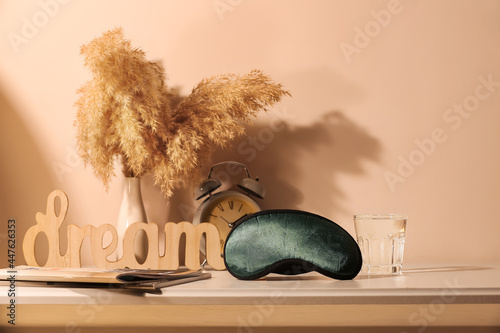 Sleeping mask with glass of...