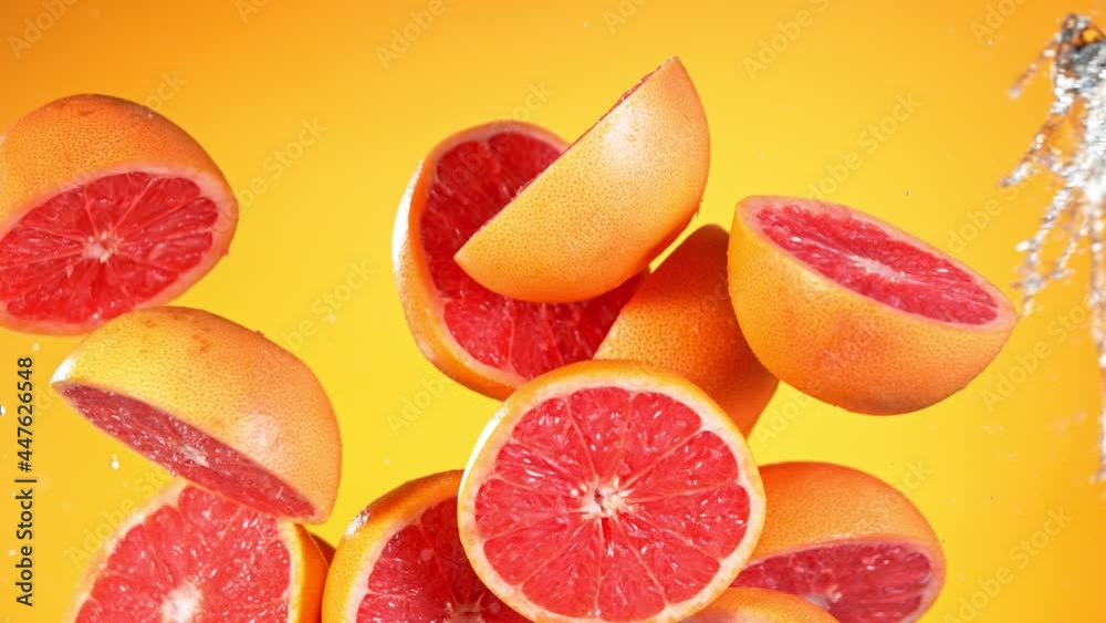 Super Slow Motion Shot of Flying Fresh Grapefruits and Water Side Splash at 1000 fps. Super Slow Motion Shot of Flying Fresh Grapefruits and Water Side Splash at 1000 fps.