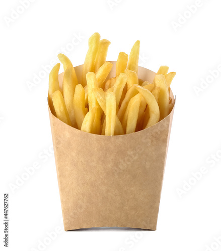 Paper bag with tasty french fries on white background