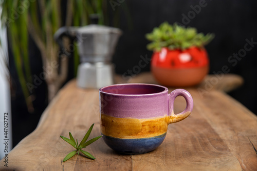 coffee cups with mocha pot on a wooden table