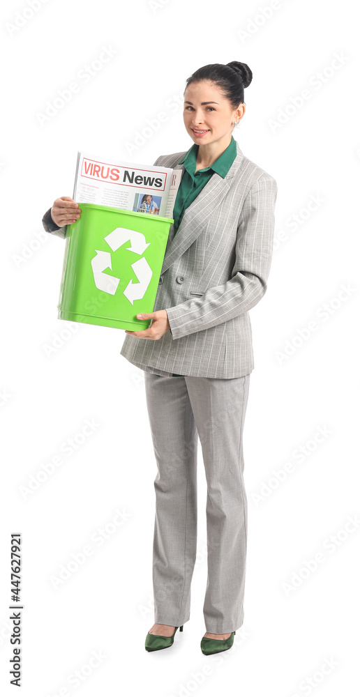 Young businesswoman and recycle bin with newspaper on white background