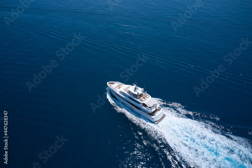Photo Superyacht is moving fast on the water top view