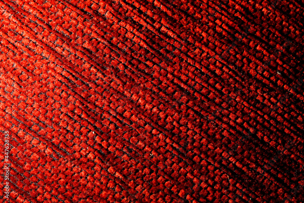 texture of a knitted woolen fabric red. Background texture of a knitted woolen fabric red. Background