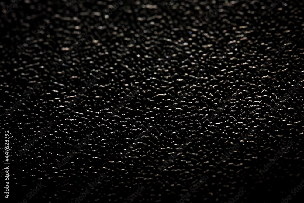 Close up Black plastic material seamless background and texture Close up Black plastic material seamless background and texture