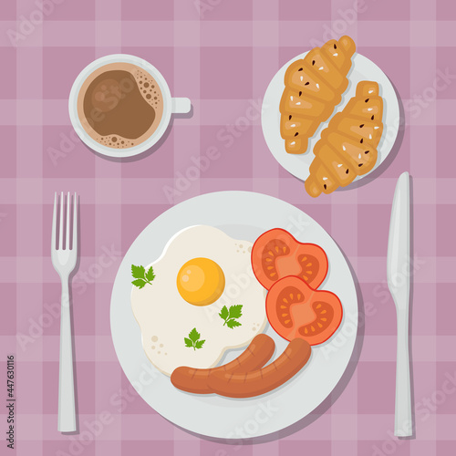 Delicious breakfast: fried eggs, coffee and croissants.