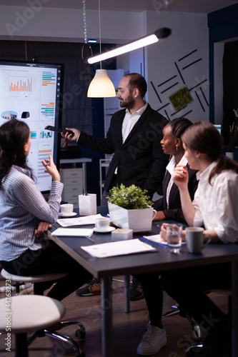 Billede på lærred Entrepreneur man brainstorming management strategy working hard in meeting office room late at night