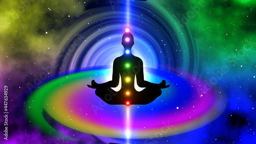 Silhouette of a seven chakra meditation person on a spiral background photo