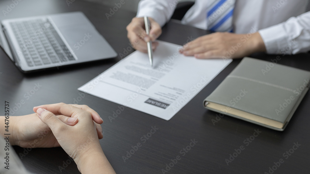 Employer or HR department is reading the resume and interviewing the ability of new employees, Employer is selecting job applicants, Employment and Recruitment Concept. Employer or HR department is reading the resume and interviewing the ability of new employees, Employer is selecting job applicants, Employment and Recruitment Concept.