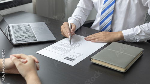 Photos Employer or HR department is reading the resume and interviewing the ability of new employees, Employer is selecting job applicants, Employment and Recruitment Concept