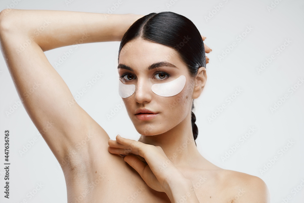woman with bare shoulders patches near eyes cosmetics woman with bare shoulders patches near eyes cosmetics