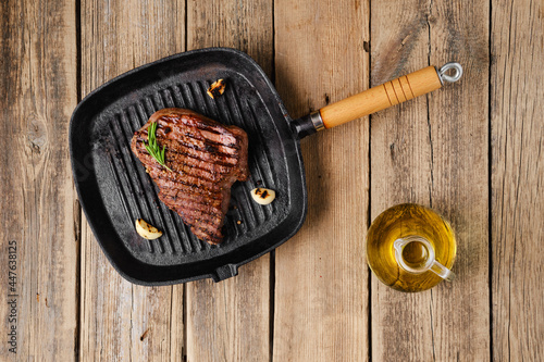 Overhead view of chuck eye steak fried on grill pan