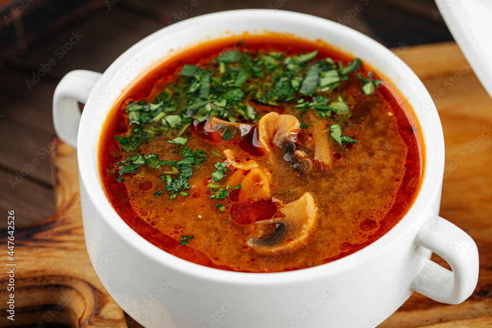 Closeup on portion of red mushroom soup Closeup on portion of red mushroom soup