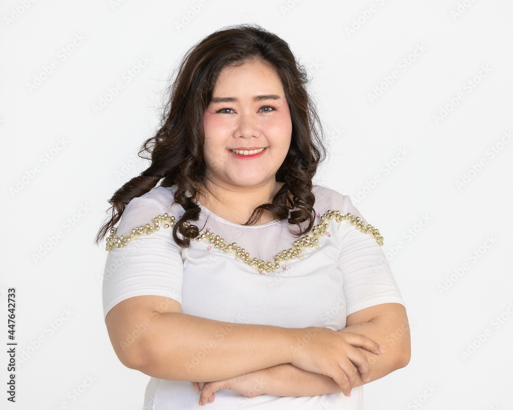 Portrait half body shot of Asian young happy cute friendly overweight fat teen long black hair female wears white shirt and short blue jeans stand smiling look at camera against white background. Portrait half body shot of Asian young happy cute friendly overweight fat teen long black hair female wears white shirt and short blue jeans stand smiling look at camera against white background.