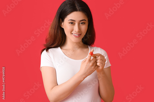 Young Asian woman with appl...