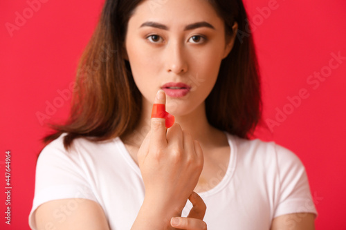 Young Asian woman with appl...