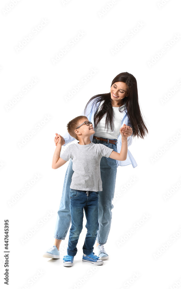 Dancing young woman and her little son on white background Dancing young woman and her little son on white background