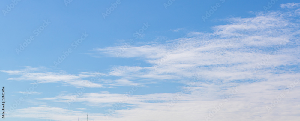White cloud on beautiful clear blue sky in summer holiday indicates excellent environment of fresh, clean air, no pollution weather, and happy to breathe for good health White cloud on beautiful clear blue sky in summer holiday indicates excellent environment of fresh, clean air, no pollution weather, and happy to breathe for good health