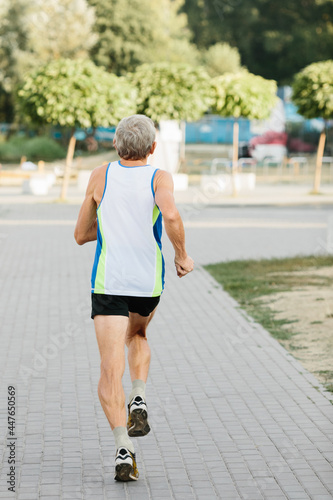 older man is engaged in running in the fresh air