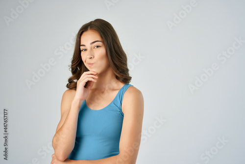brunette in blue t shirt fashion lifestyle light background model