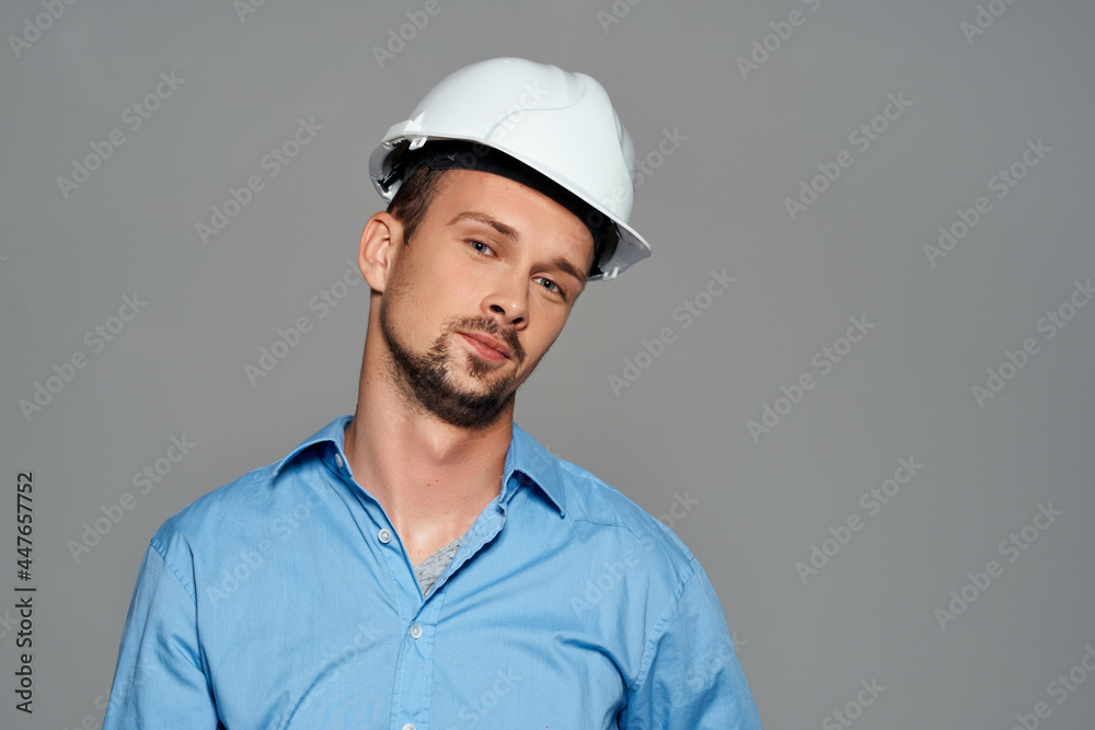 Cheerful male engineer construction helmet on his head safety work