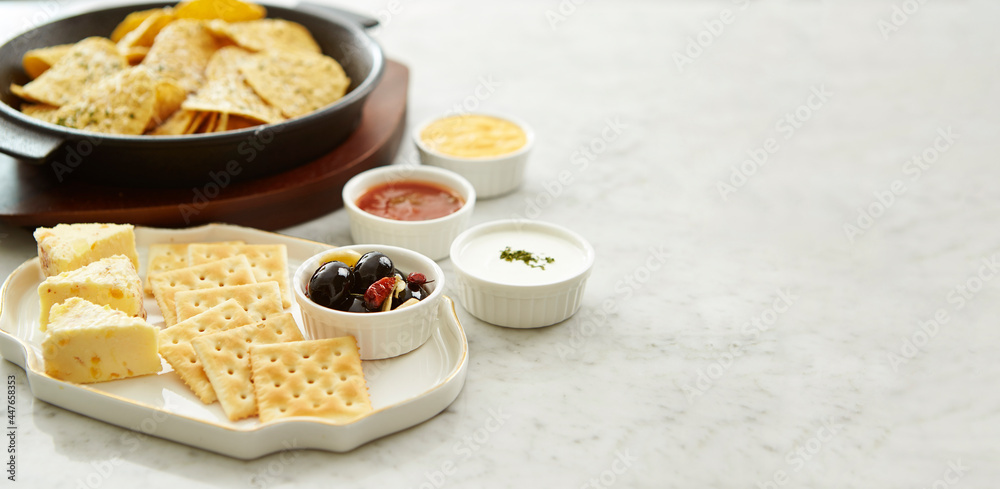 Cheese, crackers and nacho chips Cheese, crackers and nacho chips