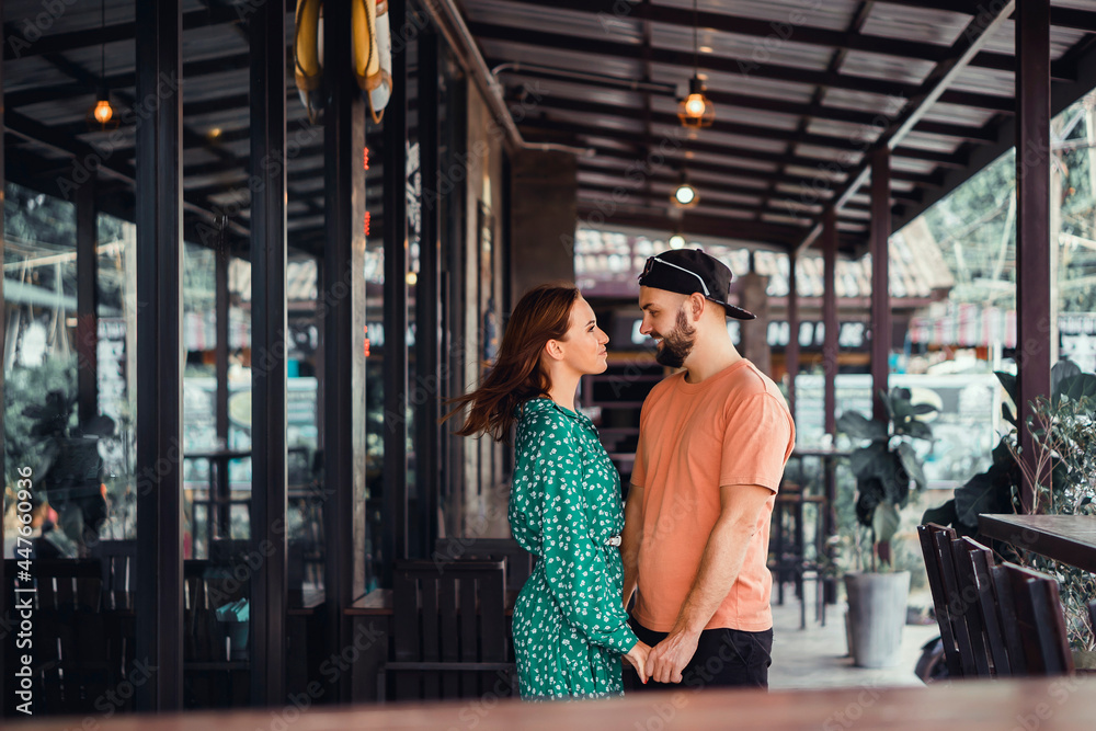 Beauty couple drinking coffee on cafe hipster style, beard man, woman in the dress, happy face, love romantic Beauty couple drinking coffee on cafe hipster style, beard man, woman in the dress, happy face, love romantic