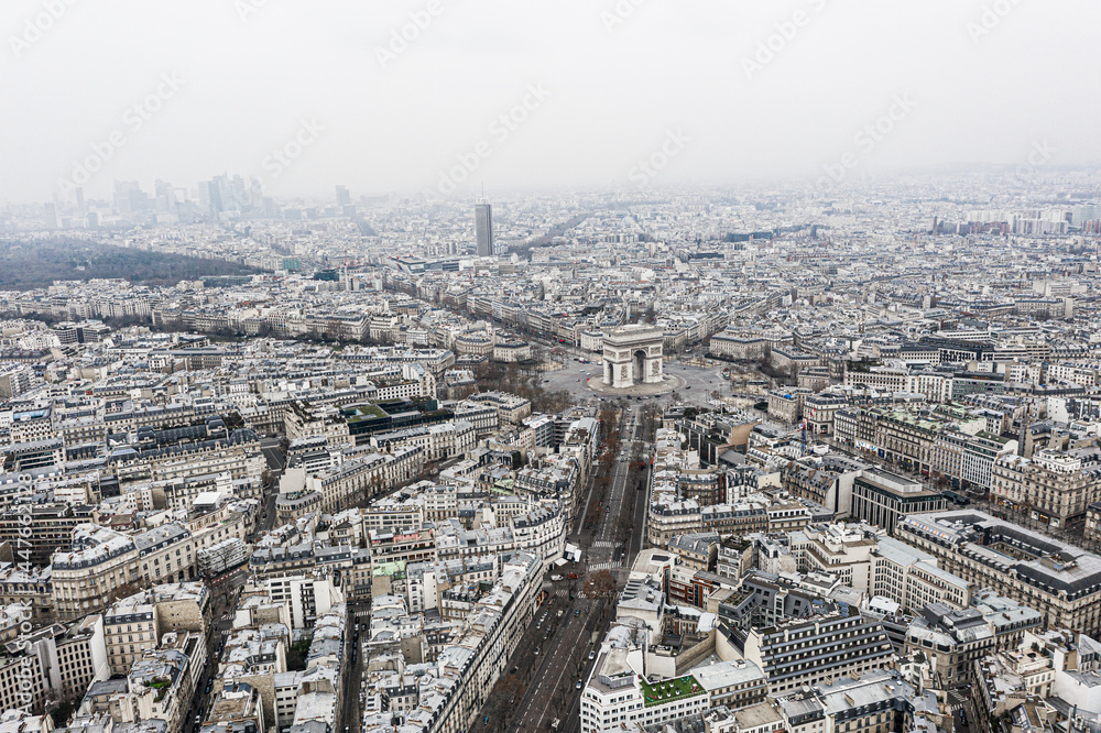 Aerial view of Arc de Triomphe, Paris and defense neighborhood.